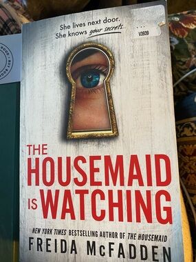 The Housemaid Is Watching - Red & White Paperback Thriller